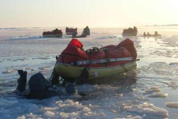 Swimming Northwards. Dry-suits are designed by us, and custom made to our specs. They really work well, and keep us dry and warm.