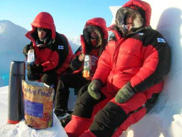 Men at lunch. Preparing lunch is quick and easy: just open the pre-packed lunch-bag, pour in hot water from the thermos flask, add a generous helping of fat, and get stuck in.